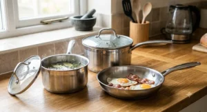 Durable stainless steel 3-piece pan set with heat-resistant glass lids for British home cooking.
